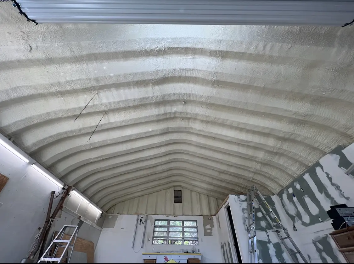 Spray polyurethane foam applied to the underside of a metal roof deck in St. Matthews